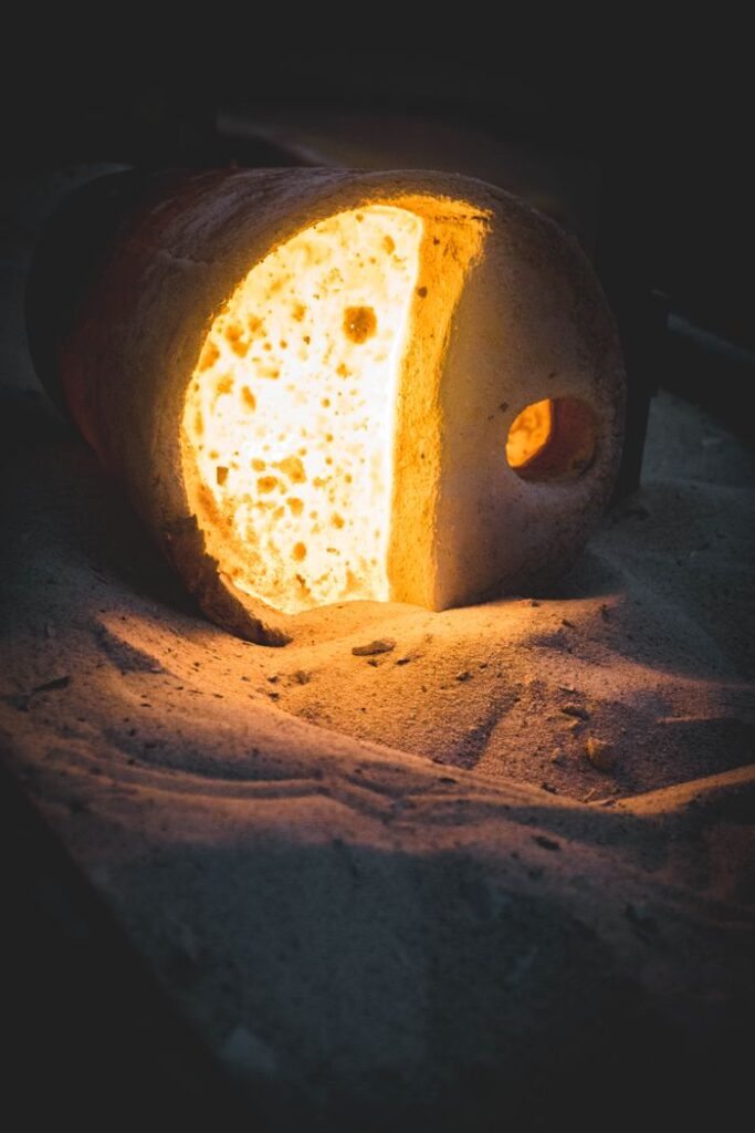Hot furnace casting with dramatic shadows - Baoya Alloy industrial metal processing